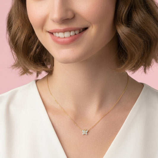 BLOOMTINE Flutterfly silver butterfly necklace in 925 sterling silver. A dainty 9mm moissanite pendant necklace with four sparkling stones on an adjustable chain