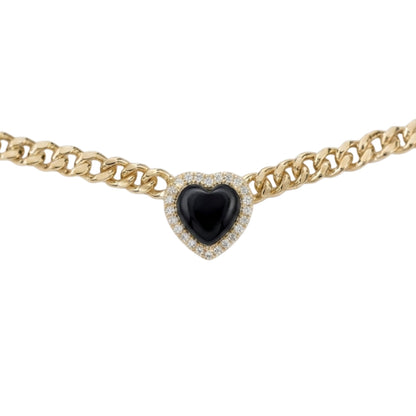 A gold chain necklace featuring a heart-shaped black onyx pendant surrounded by a halo of small clear pavé stones, shown against a plain white background.