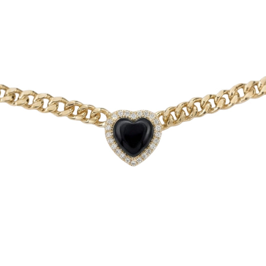 A gold chain necklace featuring a heart-shaped black onyx pendant surrounded by a halo of small clear pavé stones, shown against a plain white background.