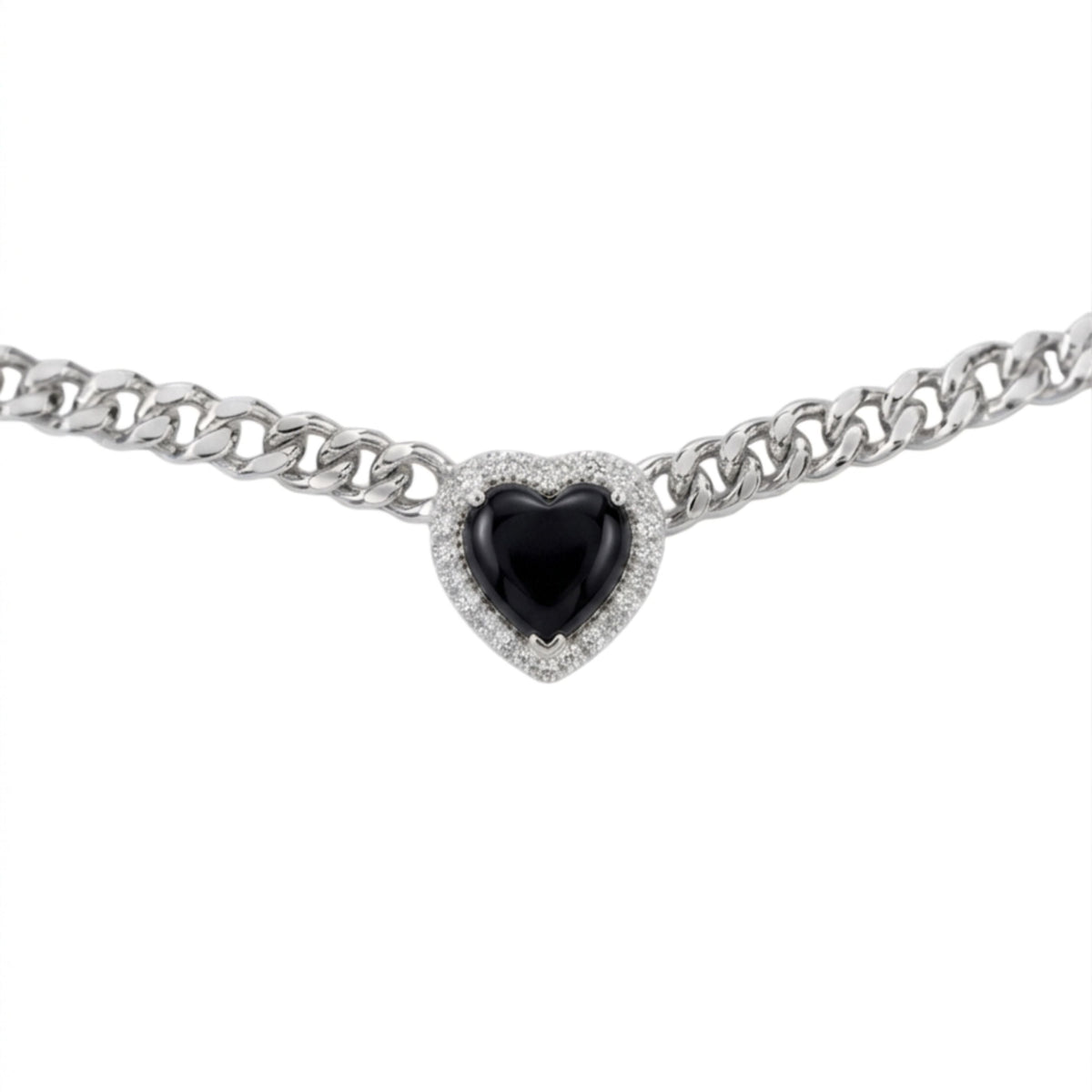 A silver-toned curb chain bracelet featuring a heart-shaped black gemstone surrounded by a halo of small clear stones, set against a plain white background.