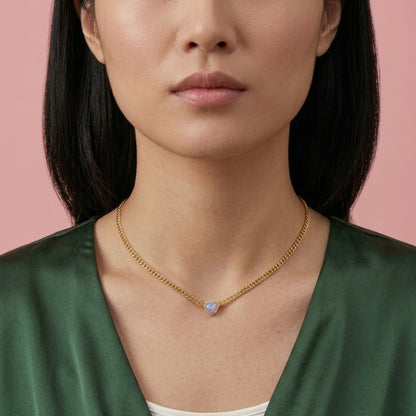 Model wearing waterproof 14k gold jewelry in water, demonstrating non-tarnish 316L steel durability.