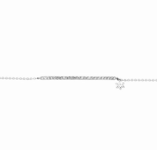 BLOOMTINE Illuminess silver bracelet in rhodium-plated sterling silver. Features a bar of 21 VVS lab-grown diamonds. An adjustable and tarnish-resistant diamond bracelet for a luxury wrist stack. Illuminess™ Sterling Silver Diamond Bar Bracelet image 0. The BLOOMTINE Illuminess™ Diamond Bar Bracelet in White Rhodium-plated Sterling Silver. Featuring 21 hand-set VVS lab-grown diamonds on a sleek bar, this adjustable stackable bracelet offers a tarnish-resistant, mirror-like luster for the extraordinary human