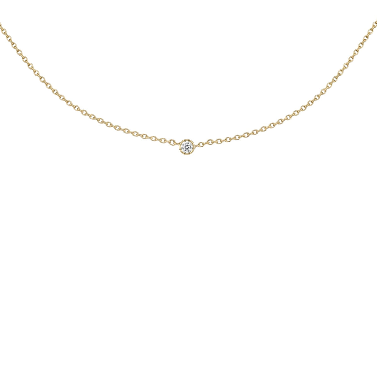 A delicate gold chain necklace with a single small round clear gemstone pendant, displayed against a solid white background.