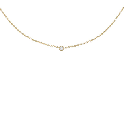 A delicate gold chain necklace with a single small round clear gemstone pendant, displayed against a solid white background.