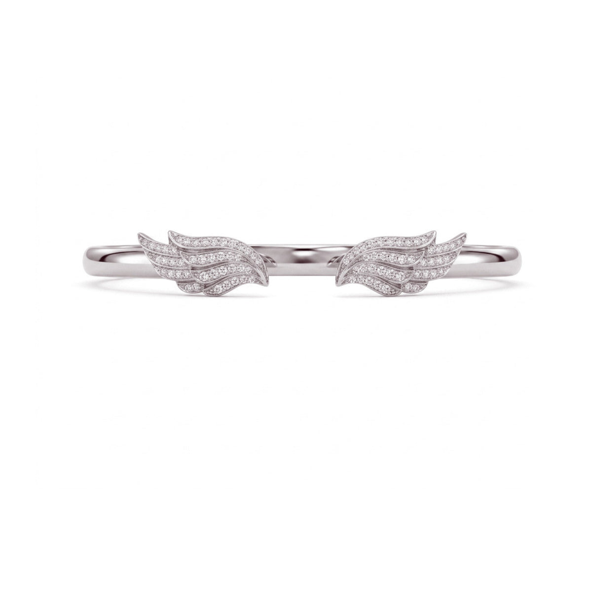 A delicate silver ring featuring two small wing motifs paved with clear stones, centered on a plain white background.
