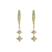 BLOOMTINE Mini Shooting Star gold star huggie earrings in 14K gold vermeil. A pair of 6mm hoop earrings featuring lab-grown moissanite stars for a curated ear stack