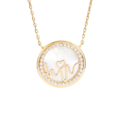 BLOOMTINE Earth Angel 18K yellow gold necklace featuring a 16mm circular mother of pearl pendant bordered by a halo of 33 round VS1 diamonds. A luxurious, meaningful gold gift