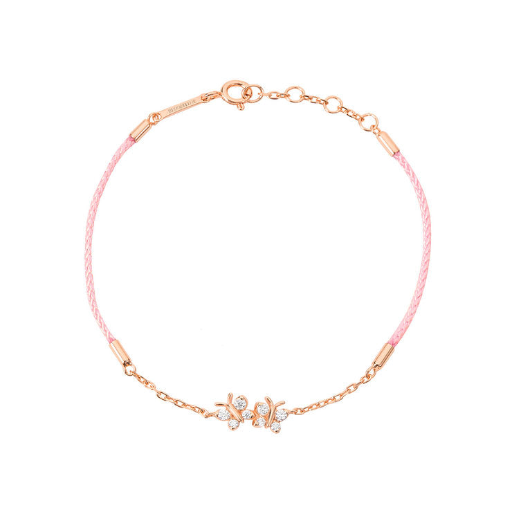 BLOOMTINE Enchanting Flutterfly rose gold butterfly bracelet in 14K rose gold vermeil. A pink silk cord bracelet featuring two iddy biddy moissanite butterflies designed as a luxury friendship bracelet. Enchanting Flutterfly™ Rose Gold Vermeil Silk Cord Butterfly Bracelet