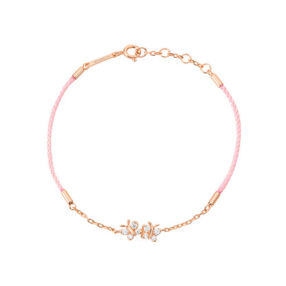 BLOOMTINE Enchanting Flutterfly rose gold butterfly bracelet in 14K rose gold vermeil. A pink silk cord bracelet featuring two iddy biddy moissanite butterflies designed as a luxury friendship bracelet. Enchanting Flutterfly™ Rose Gold Vermeil Silk Cord Butterfly Bracelet