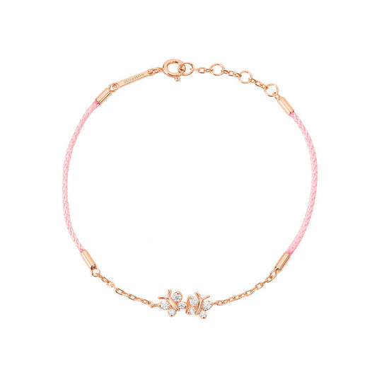 BLOOMTINE Enchanting Flutterfly rose gold butterfly bracelet in 14K rose gold vermeil. A pink silk cord bracelet featuring two iddy biddy moissanite butterflies designed as a luxury friendship bracelet. Enchanting Flutterfly™ Rose Gold Vermeil Silk Cord Butterfly Bracelet