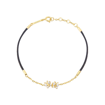 BLOOMTINE Enchanting Flutterfly butterfly bracelet in 14K gold vermeil. A black silk cord bracelet featuring 8 moissanites. Adjustable and durable gold vermeil jewelry for women