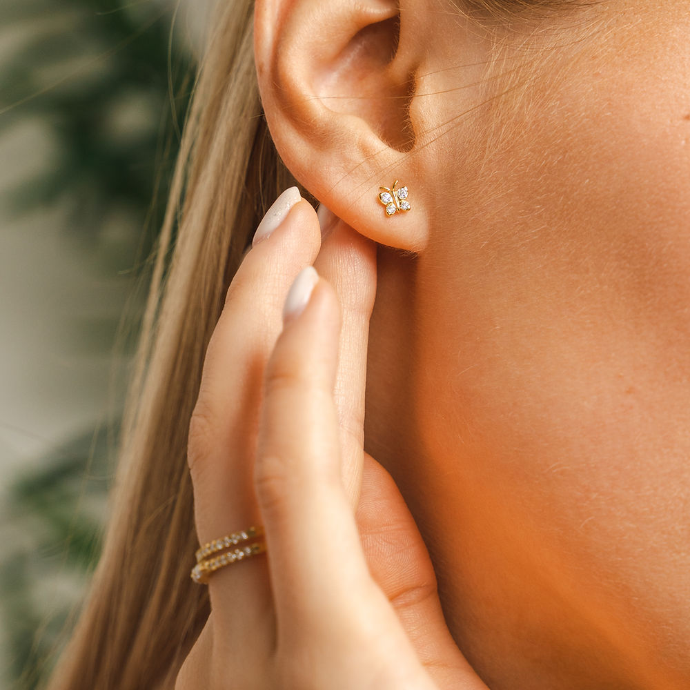 BLOOMTINE Enchanting Flutterfly™ Butterfly Studs in 925 Sterling Silver. These 5mm dainty earrings feature 8 brilliant-cut lab moissanites, symbolizing transformation and resilience. Handcrafted for the extraordinary human and available at Wolf & Badger