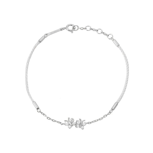 BLOOMTINE Enchanting Flutterfly silver butterfly bracelet in 925 sterling silver. A black silk cord bracelet featuring two iddy biddy moissanite butterflies designed as a luxury friendship bracelet. Enchanting Flutterfly™ (Butterfly) Sterling Silver Silk Cord Bracelet