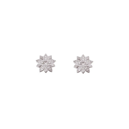 A macro close-up of the BLOOMTINE Eternal Bloom 14K white gold earrings. A pair of 3D layered diamond lotus earrings featuring 12 encrusted round VS1 diamonds with secure butterfly push backs.