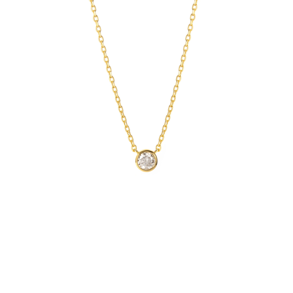 A BLOOMTINE Illuminess™ Gold Necklace featuring a small round-cut lab moissanite pendant. The brilliant-cut stone is set in premium 18k gold-plated sterling silver, shown flat against a white background to highlight the warm luster and 'Extraordinary Human' craftsmanship
