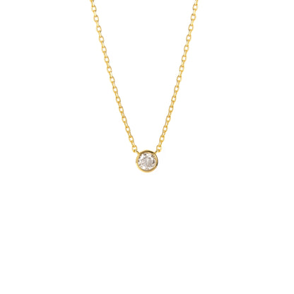 A BLOOMTINE Illuminess™ Gold Necklace featuring a small round-cut lab moissanite pendant. The brilliant-cut stone is set in premium 18k gold-plated sterling silver, shown flat against a white background to highlight the warm luster and 'Extraordinary Human' craftsmanship