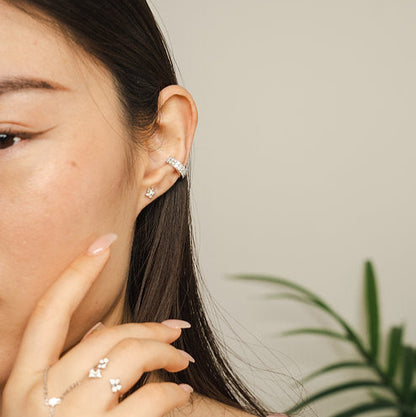 The BLOOMTINE Illuminess™ Double Ear Cuff in White Rhodium-plated Sterling Silver. This 'no-piercing' moissanite cuff features a double-row sparkle design and a secret 'You are Magic' interior engraving, perfect for an effortless and adjustable celestial ear stack