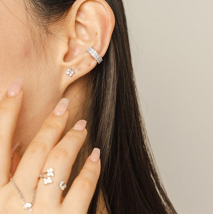 Adjustable sterling silver double ear cuff by BLOOMTINE set with high-brilliance lab moissanites. This tarnish-resistant, hypoallergenic 'no-piercing required' cartilage cuff features a premium white rhodium finish and a signature mantra engraving, offering a secure and non-invasive jewelry gift