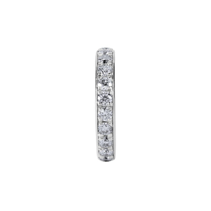 Diamond eternity ring on a white background. The BLOOMTINE Illuminess™ Single Ear Cuff in White Rhodium-plated Sterling Silver. A 'no-piercing' cartilage hoop featuring brilliant lab moissanites and a hidden 'You are Magic' mantra engraving, designed for a tarnish-resistant and effortless ear stack