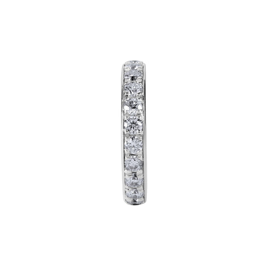 Diamond eternity ring on a white background. The BLOOMTINE Illuminess™ Single Ear Cuff in White Rhodium-plated Sterling Silver. A 'no-piercing' cartilage hoop featuring brilliant lab moissanites and a hidden 'You are Magic' mantra engraving, designed for a tarnish-resistant and effortless ear stack