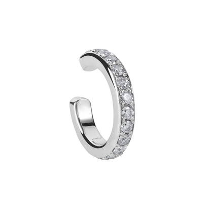 Silver hoop earring with embedded stones on a white background. Adjustable sterling silver single ear cuff by BLOOMTINE with high-brilliance moissanite stones. This hypoallergenic, 'needle-free' cartilage cuff features a mirror-like white rhodium finish and an internal empowerment inscription. An ethical, non-invasive jewelry gift sold individually