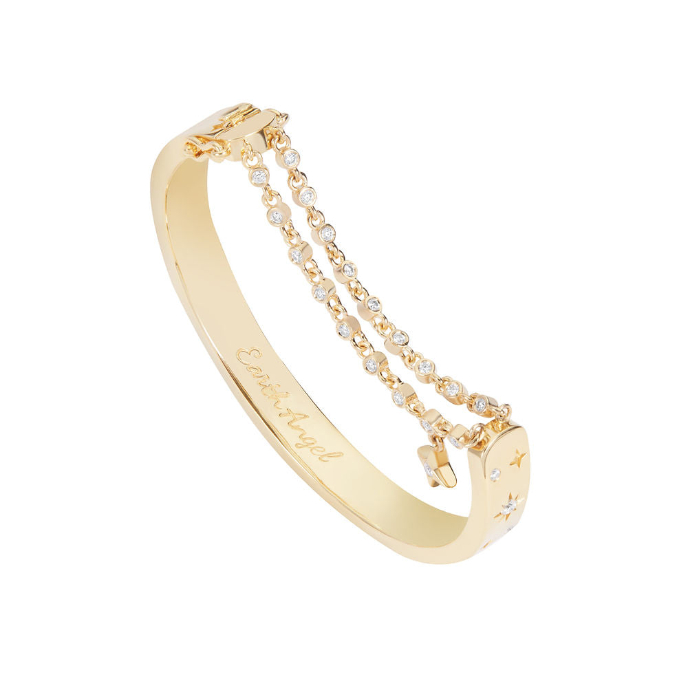The BLOOMTINE Illuminess™ Starset Bangle in heavy 14K Gold Vermeil. Featuring 4-point and 8-point stars set with brilliant moissanites and an interior 'You are Magic' engraving, this 35g solid silver talisman is designed to manifest abundance and success