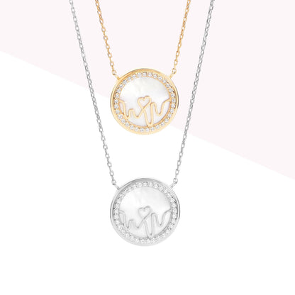 Bloomtine-set-of-necklaces-with-round-pendants. A professional-product-arrangement of multiple-necklaces featuring-circular-heart-medallion-charms on a crisp-white-background. This-collection includes-both-18kt-gold-vermeil and 925-sterling-silver-options, showcasing minimalist-round-pendants on fine-adjustable-chains. Ideal-for-jewellery-layering, these-versatile-necklaces are designed-for-gifting and highlight the-polished-finish and botanical-engravings of the-Bloomtine-Loves-Frequency-signature-collecti