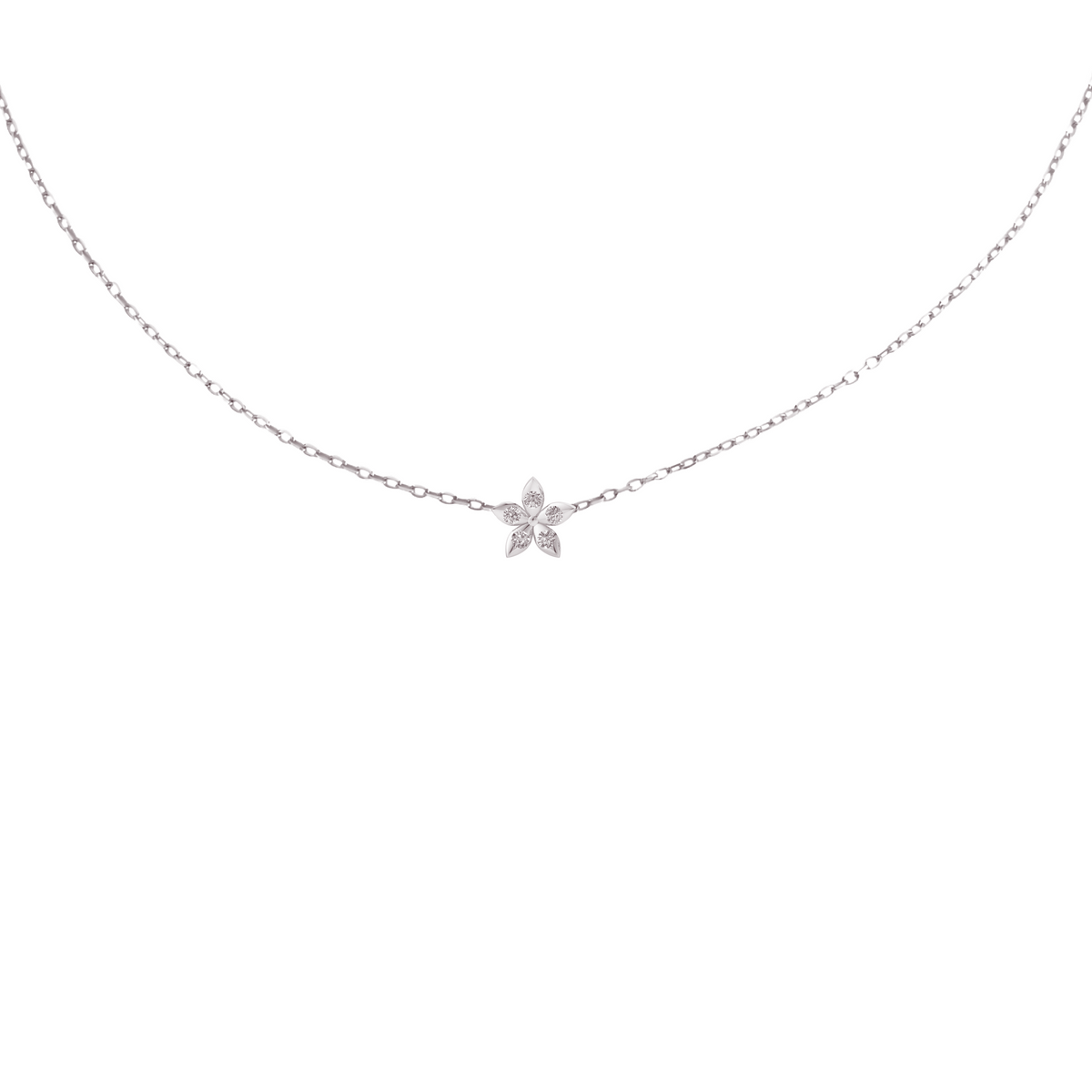 BLOOMTINE Mini Eternal Bloom sterling silver necklace featuring a 10mm flower pendant with a moissanite center. A dainty, handcrafted silver necklace on an adjustable chain for layering.