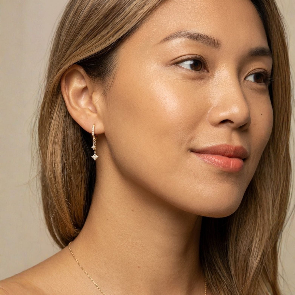Illuminess™ Mini Gold Vermeil Shooting Star Huggies BLOOMTINE | Earth Angel HQ. BLOOMTINE Mini Shooting Star silver huggie earrings in rhodium-plated sterling silver. 6mm celestial hoops set with moissanite stars. Tarnish-resistant and meaningful silver earrings for ear stacking