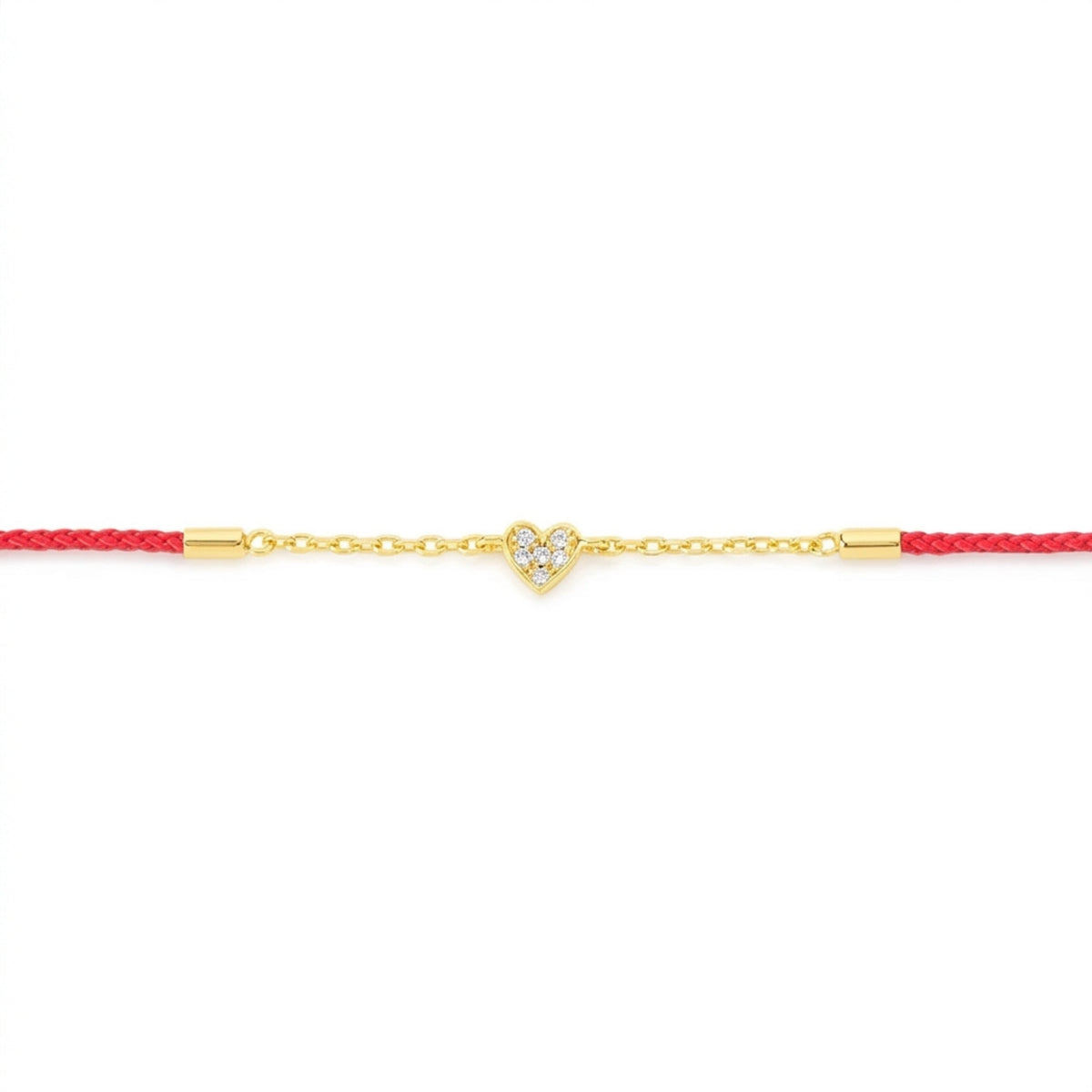 A delicate gold chain bracelet featuring a small heart-shaped charm paved with clear stones, suspended on a vibrant red cord with gold end caps, set against a plain white background.
