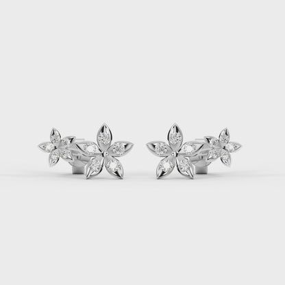 Bloomtine-sterling-silver-eternal-bloom-earrings. A high-quality-product-shot of 925-sterling-silver-flower-studs, designed-as-the-perfect-gift-for-her. These-dainty-floral-earrings feature a polished-silver-blossom-design and are crafted-from-genuine-solid-sterling-silver. Shown-on-a-clean-white-background, these-minimalist-botanical-studs highlight the-intricate-craftsmanship and timeless-style of the Bloomtine-silver-jewellery-collection